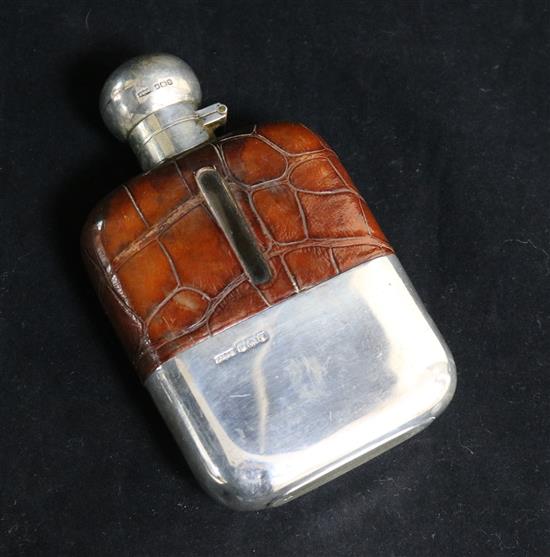 A 1920s silver and leather mounted glass hip flask by James Dixon & Sons Ltd, Sheffield, 1924, 14.5cm.